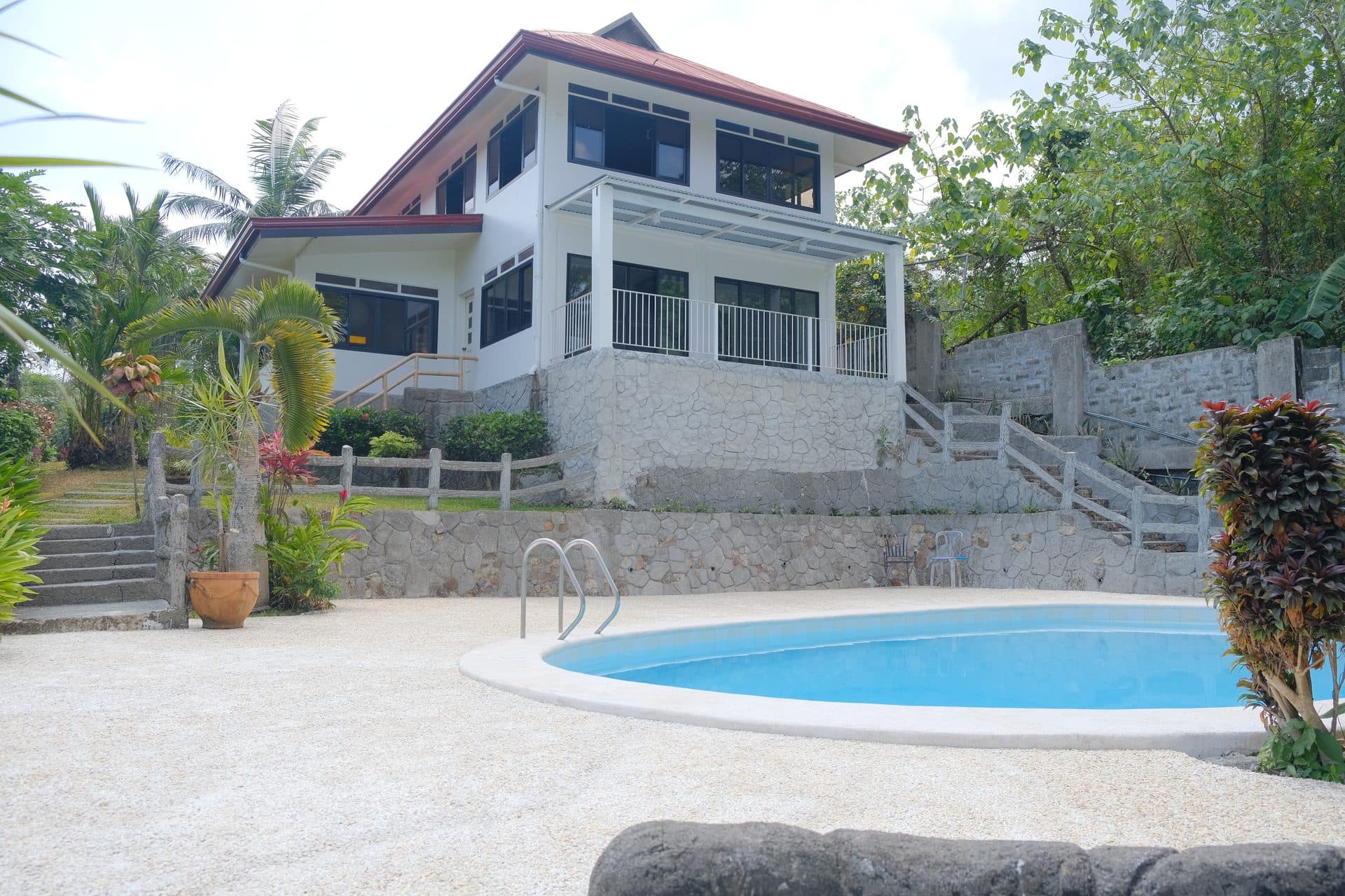 Wide view of the property facade and pool