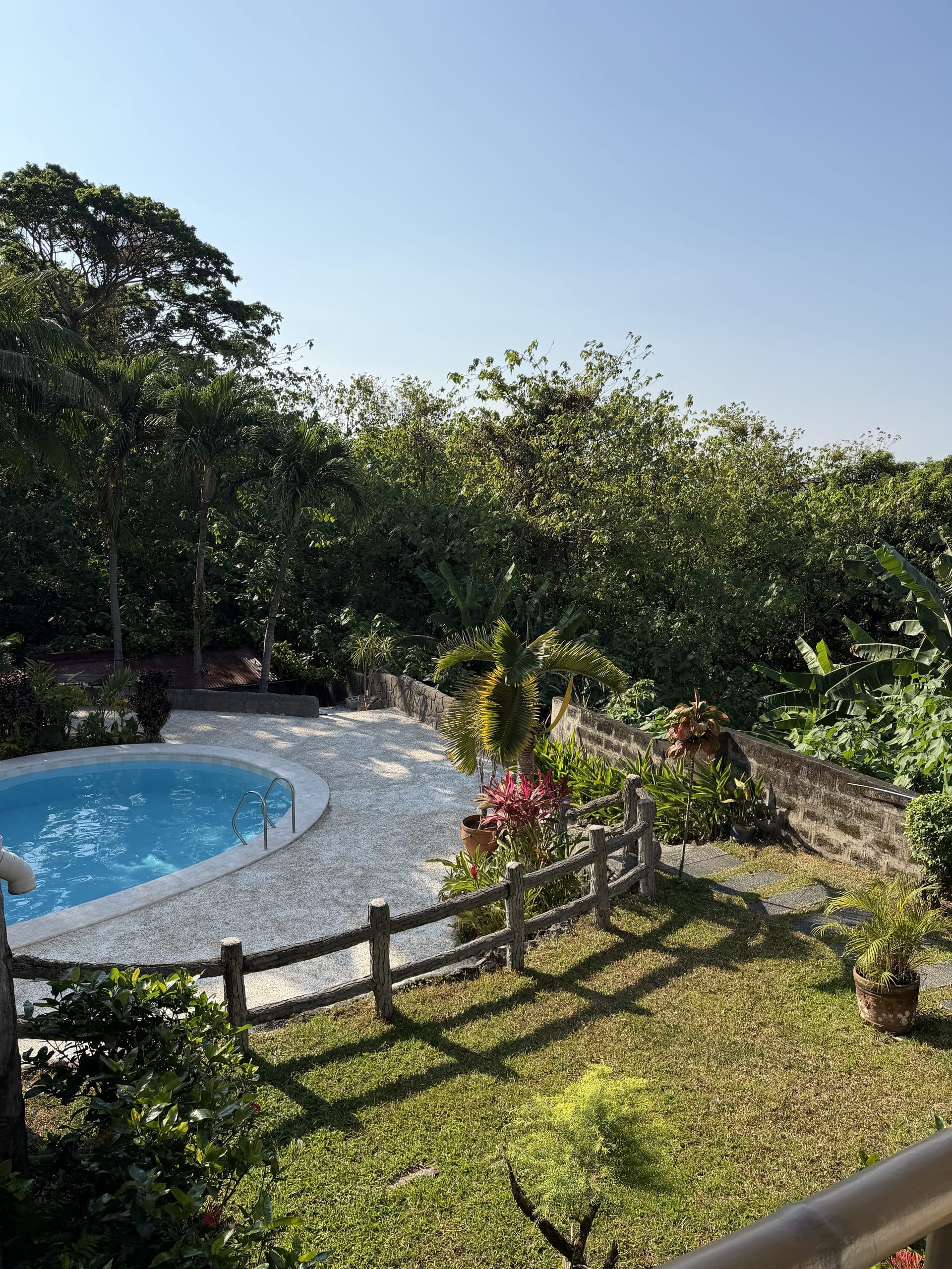 Pool and garden seen from the upper balcony